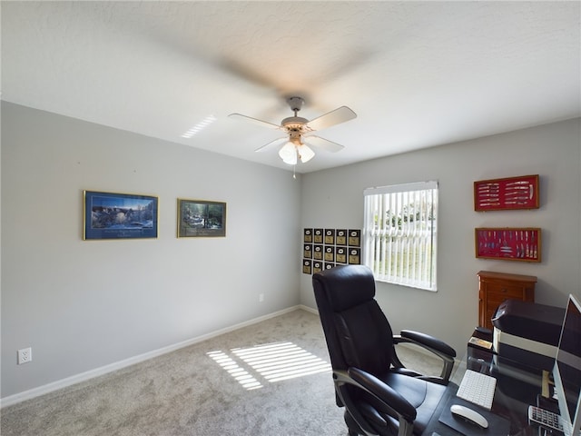 carpeted office with ceiling fan