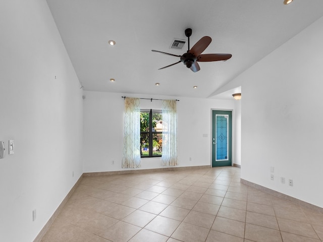 tiled spare room with ceiling fan