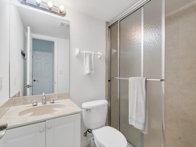 3554 Ocean Dr Unit 202S, Vero Beach, FL 32963 - bathroom featuring a stall shower, toilet, and vanity