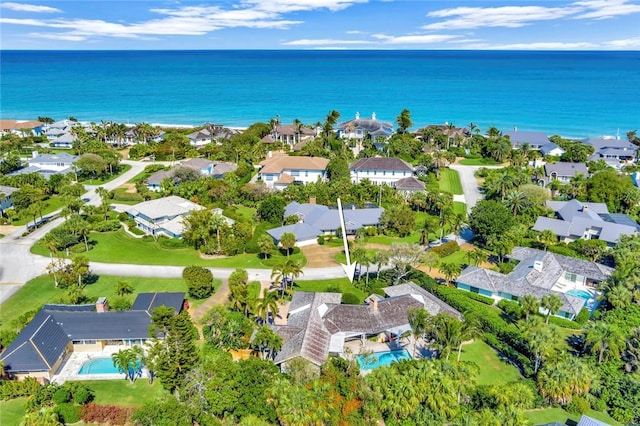 bird's eye view featuring a residential view and a water view