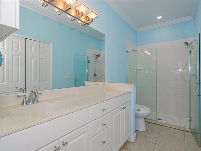 bathroom with tile patterned flooring, vanity, ornamental molding, a shower with shower door, and toilet