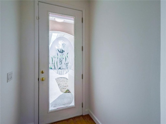 doorway to outside with light hardwood / wood-style floors