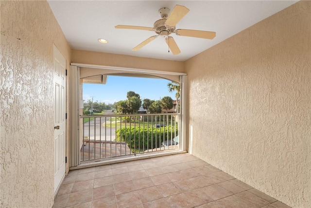 interior space with ceiling fan