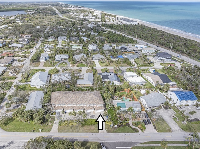 birds eye view of property featuring a water view and a view of the beach