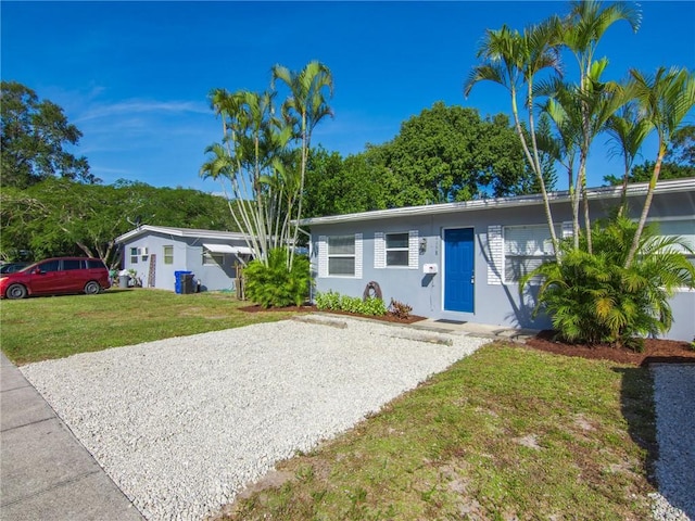 ranch-style home with a front yard