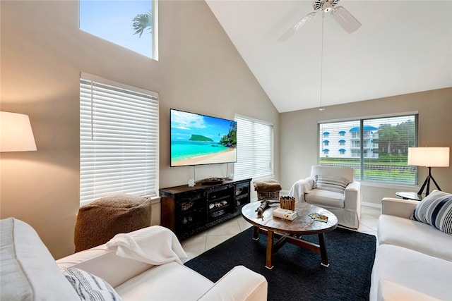 tiled living room with high vaulted ceiling and ceiling fan