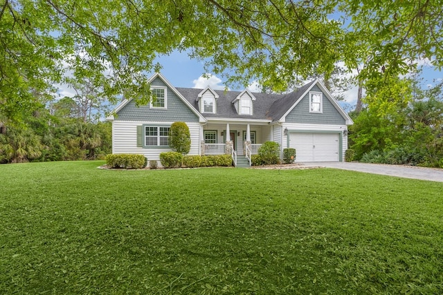 view of front of house featuring a garage, a front yard, and covered porch