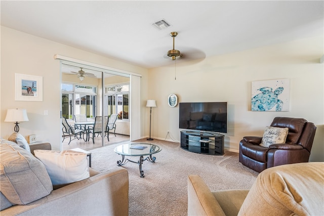 carpeted living room featuring ceiling fan