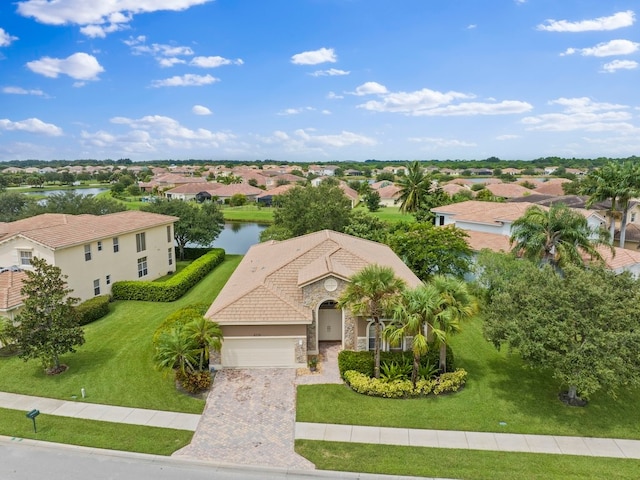 birds eye view of property with a water view