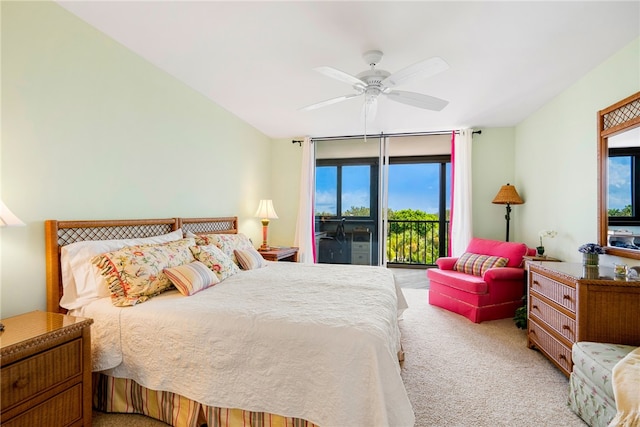 bedroom with ceiling fan, multiple windows, light carpet, and access to outside