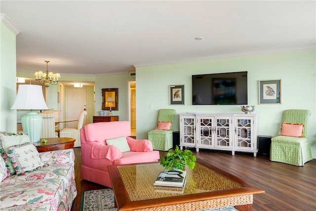 living room featuring dark wood-type flooring, a chandelier, and ornamental molding