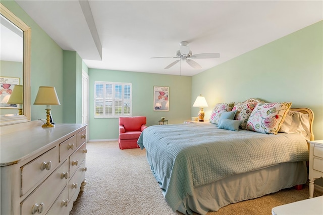 bedroom with light carpet and ceiling fan