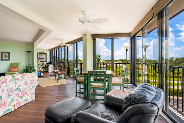 sunroom / solarium featuring ceiling fan