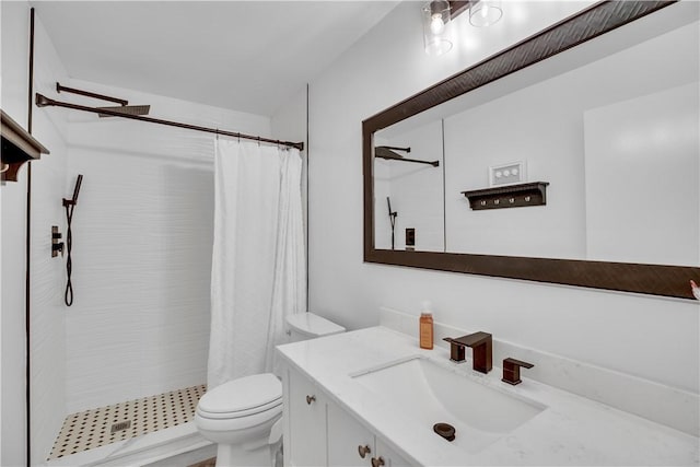 bathroom featuring toilet, a shower with curtain, and vanity