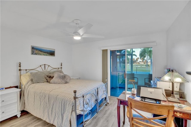 bedroom featuring light hardwood / wood-style floors, ceiling fan, and access to outside