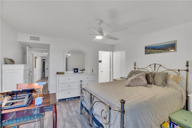 bedroom with ceiling fan and light wood-type flooring