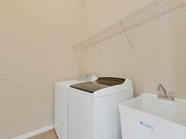 8340 Paladin Sq, Vero Beach, FL 32967 - washroom featuring independent washer and dryer and light tile patterned flooring