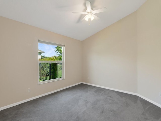 8340 Paladin Sq, Vero Beach, FL 32967 - spare room with dark carpet, ceiling fan, and vaulted ceiling
