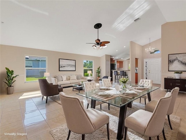 8340 Paladin Sq, Vero Beach, FL 32967 - dining space with a chandelier, a ceiling fan, light tile patterned flooring, and high vaulted ceiling
