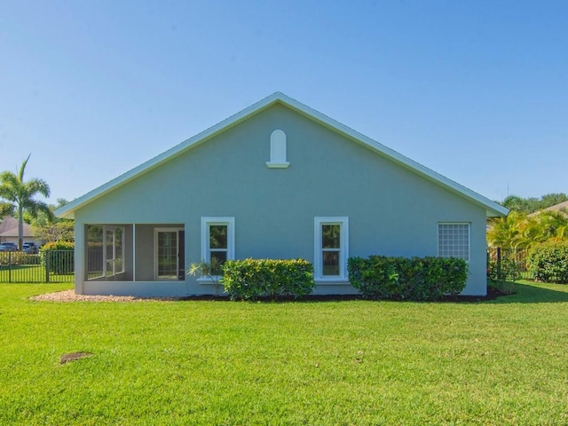 8340 Paladin Sq, Vero Beach, FL 32967 - back of property with stucco siding and a sunroom