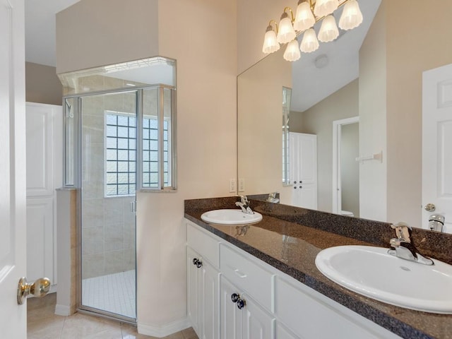 8340 Paladin Sq, Vero Beach, FL 32967 - bathroom with a stall shower, double vanity, and tile patterned flooring