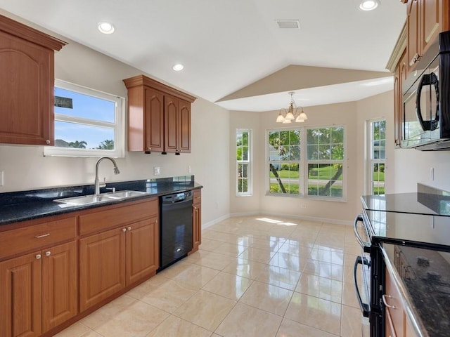 8340 Paladin Sq, Vero Beach, FL 32967 - kitchen featuring black appliances, a chandelier, vaulted ceiling, brown cabinetry, and light tile patterned floors