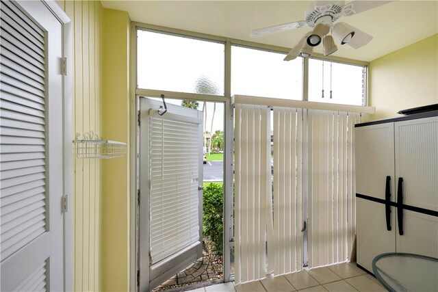 interior space featuring ceiling fan and light tile patterned flooring