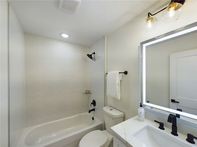full bath with shower / tub combination, vanity, toilet, a textured ceiling, and visible vents