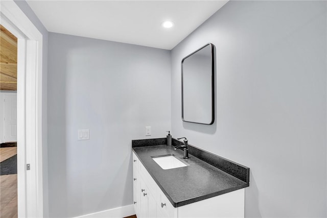 7205 Kamelya St SW, Vero Beach, FL 32968 - bathroom with baseboards, recessed lighting, and vanity