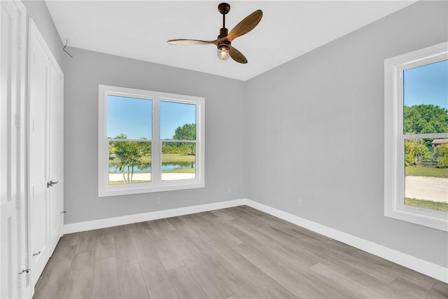 7205 Kamelya St SW, Vero Beach, FL 32968 - unfurnished bedroom featuring baseboards, wood finished floors, and a ceiling fan