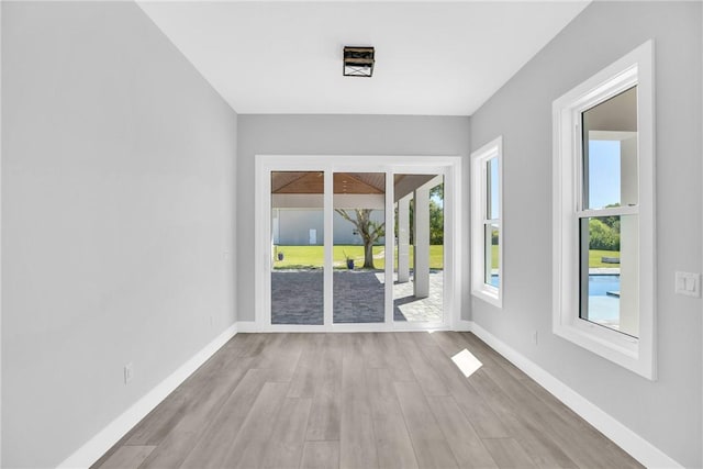 7205 Kamelya St SW, Vero Beach, FL 32968 - empty room featuring baseboards and wood finished floors