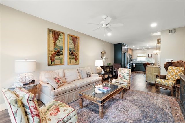 living room with dark hardwood / wood-style floors and ceiling fan