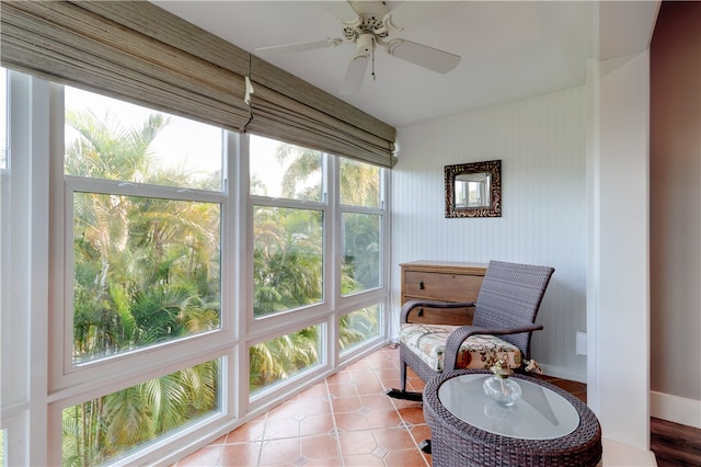 sunroom with ceiling fan and a healthy amount of sunlight