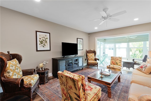 living room featuring ceiling fan and wood-type flooring