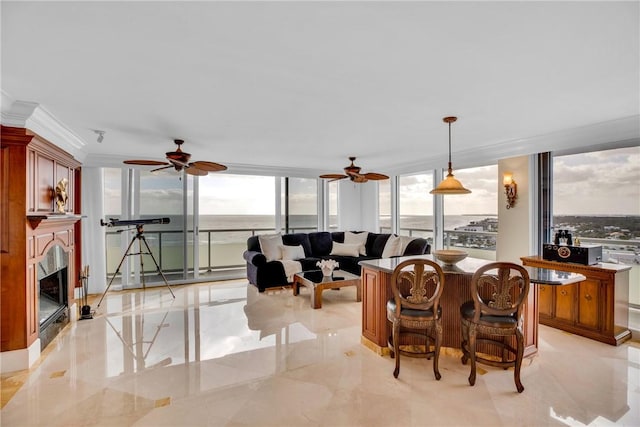 3554 Ocean Dr Ph 4S, Vero Beach, FL 32963 - living area featuring floor to ceiling windows, a ceiling fan, plenty of natural light, and a fireplace