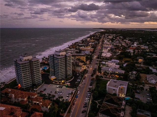 aerial view at dusk with a water view