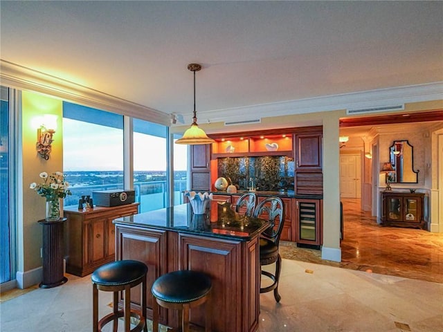 bar with crown molding, decorative light fixtures, and beverage cooler