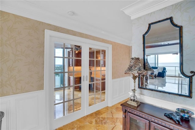 3554 Ocean Dr Ph 4S, Vero Beach, FL 32963 - doorway to outside with a wainscoted wall, a decorative wall, crown molding, wallpapered walls, and french doors