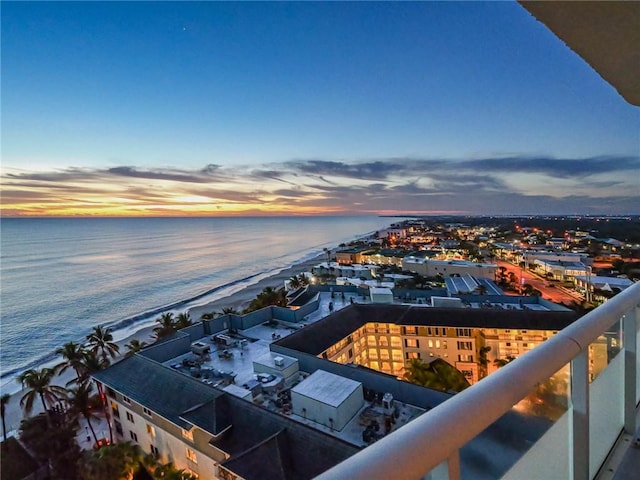 aerial view at dusk with a water view