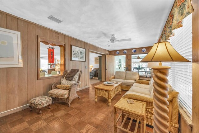 843 22nd Pl, Vero Beach, FL 32960 - living room featuring wood walls and ceiling fan