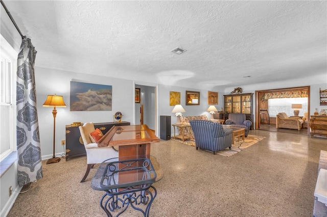 843 22nd Pl, Vero Beach, FL 32960 - living area with a textured ceiling and speckled floor