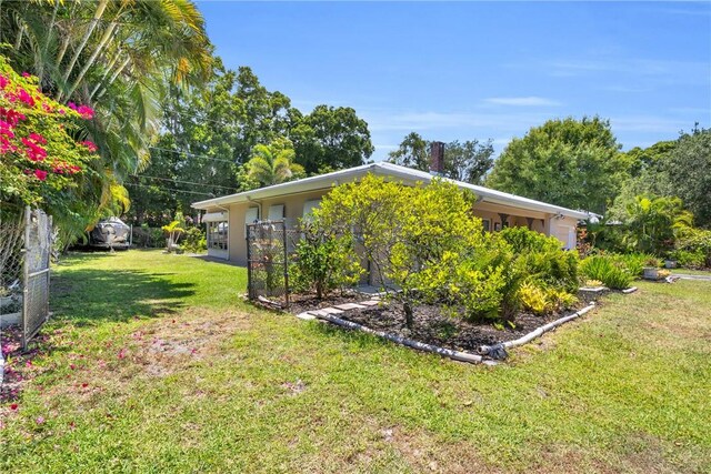 843 22nd Pl, Vero Beach, FL 32960 - view of home's exterior featuring a yard