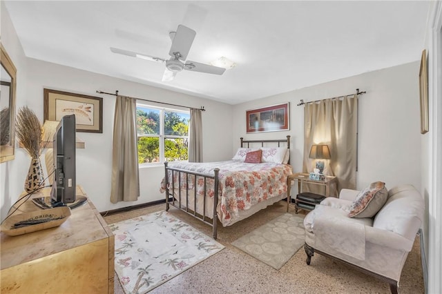 843 22nd Pl, Vero Beach, FL 32960 - bedroom with dark aggregate flooring, a baseboard heating unit, and ceiling fan