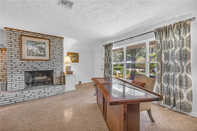 843 22nd Pl, Vero Beach, FL 32960 - dining room with a textured ceiling, speckled floor, and a fireplace