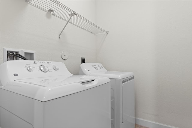 laundry room featuring separate washer and dryer