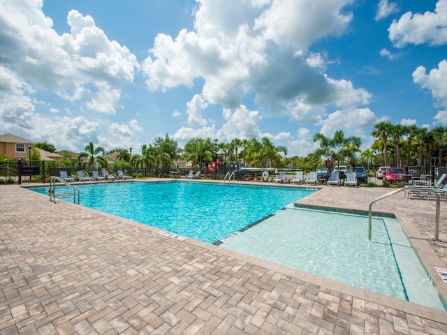 view of swimming pool with a patio