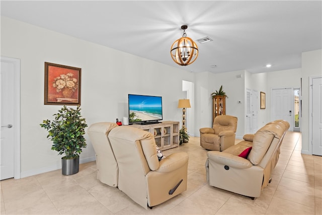 tiled living room with an inviting chandelier