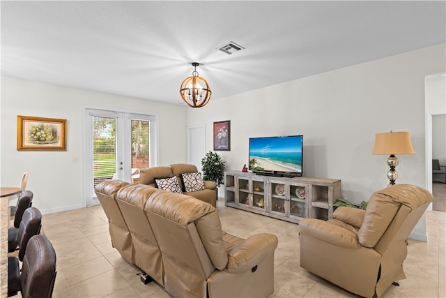 tiled living room featuring french doors and a notable chandelier