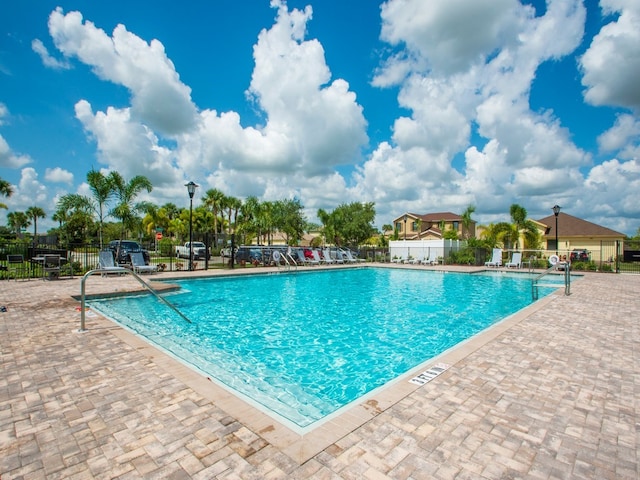 view of swimming pool with a patio area