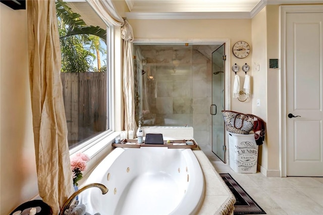 bathroom with crown molding, tile patterned floors, and separate shower and tub